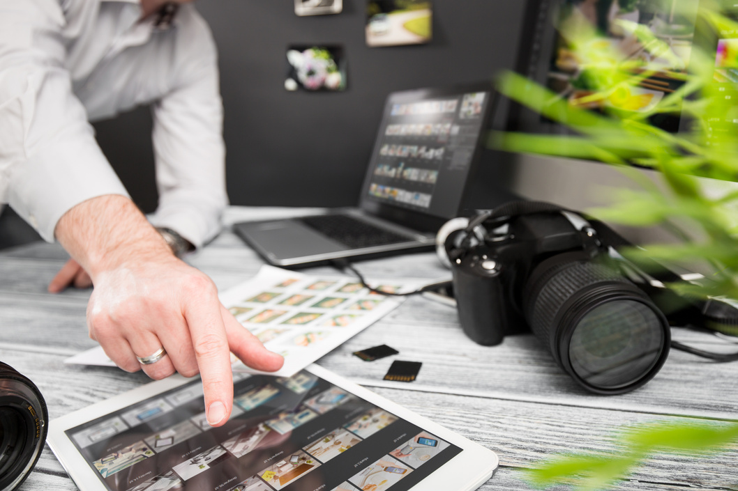 Photographers Computer with Photo Edit Programs.